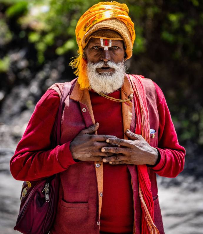 A vertical shot of a Baba Ji Pilgrim at Muktinath Mountain Temple in Mustang, Nepal